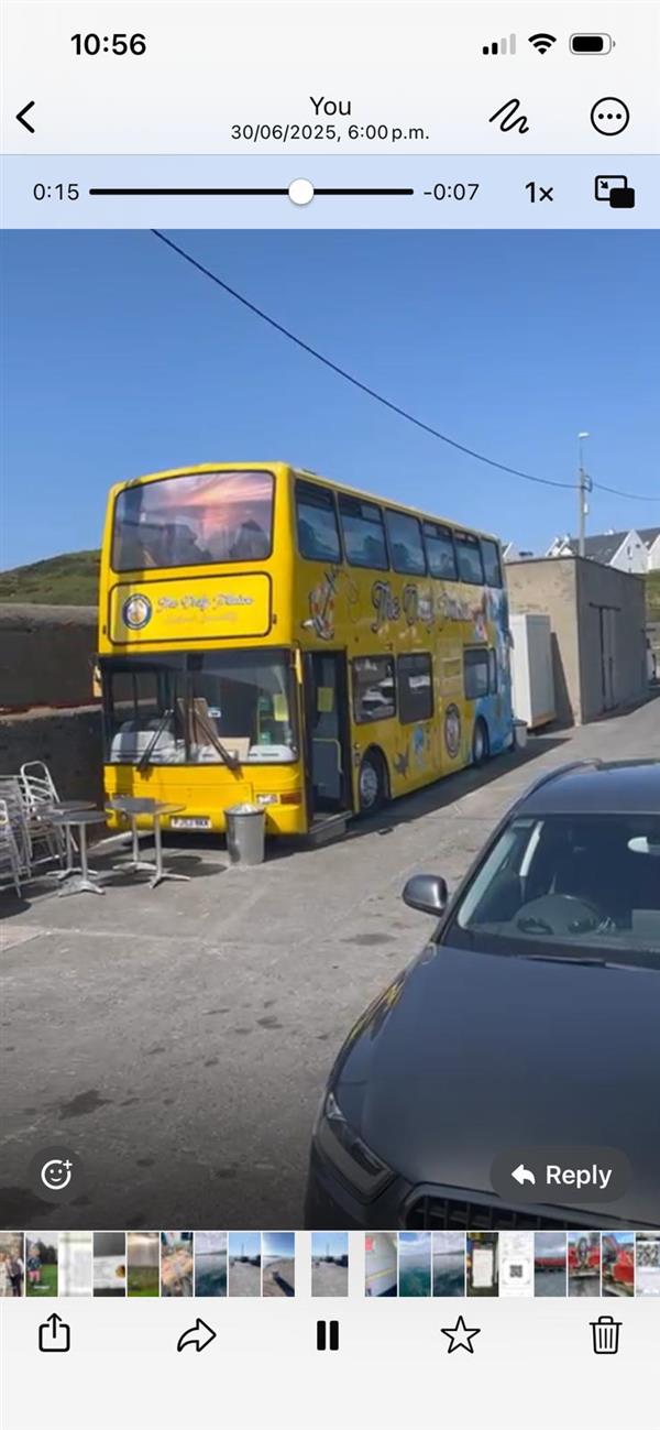 Mobile fish and chip ship with upper deck dining area.