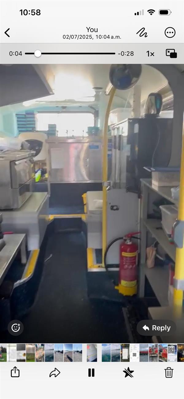 Mobile fish and chip ship with upper deck dining area.